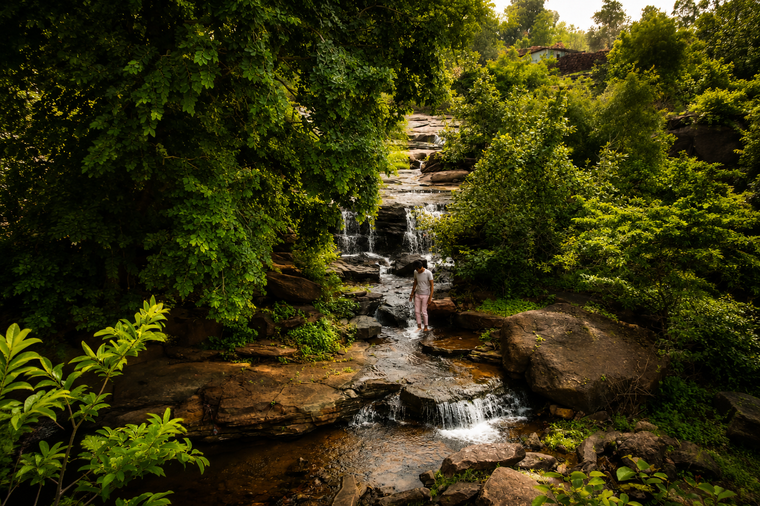 Green rocky stream and waterfall near DERA CAMP by Aaranya