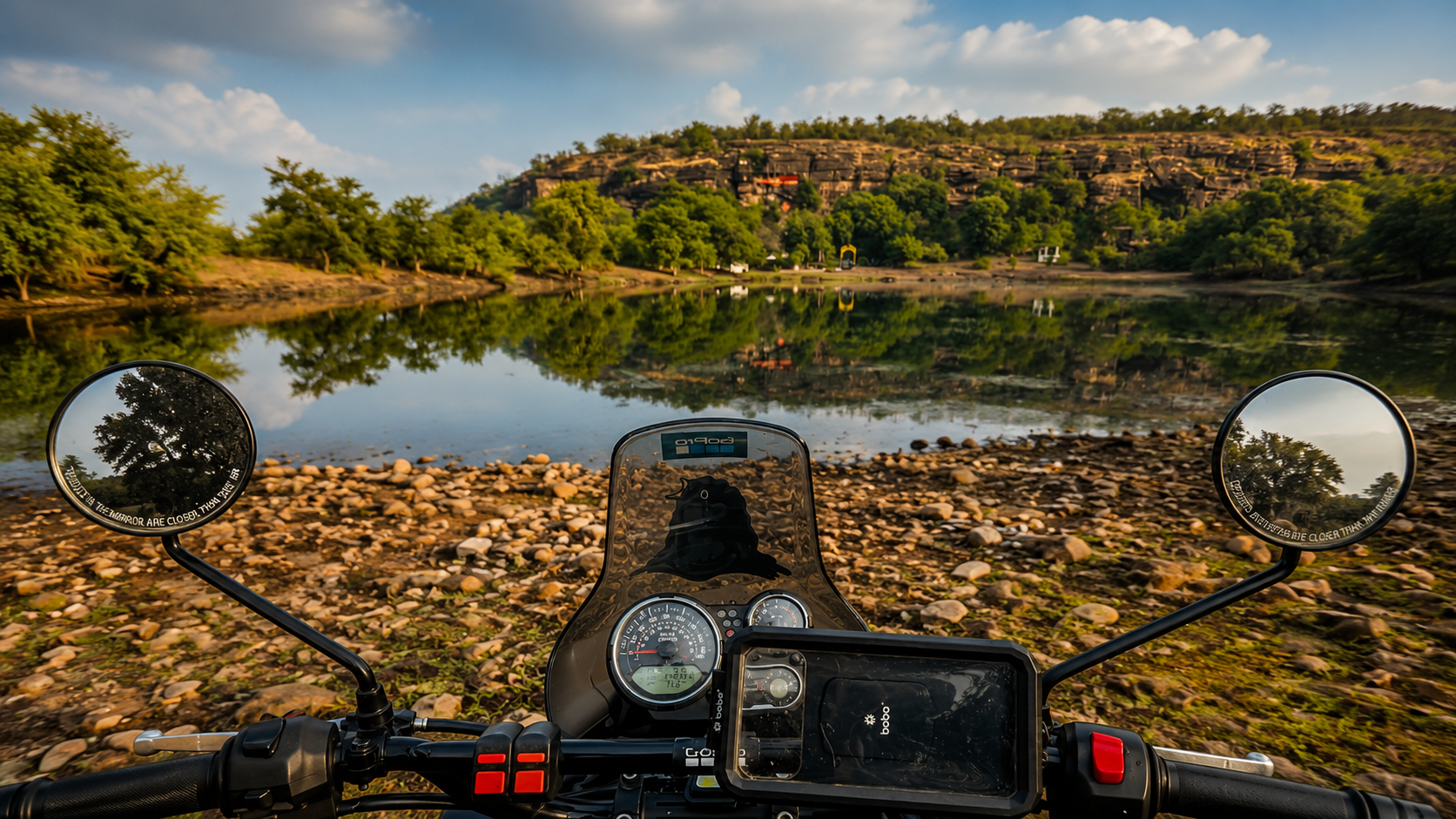 Motorcycle view beside a lake and rocky hills near DERA CAMP by Aaranya